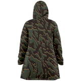 A hooded jacket shown from the back, featuring an all-over organic camouflage pattern in dark green, black, and brown with thin tan outlines.