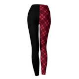 Black and red plaid leggings on a light gray background