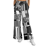 Black and white patterned wide-leg pants worn by a person on a white background