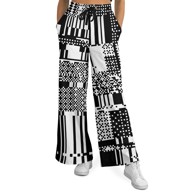 Black and white patterned wide-leg pants worn by a person on a white background